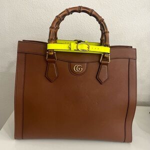 Gucci medium brown with a brown crossbody strap.